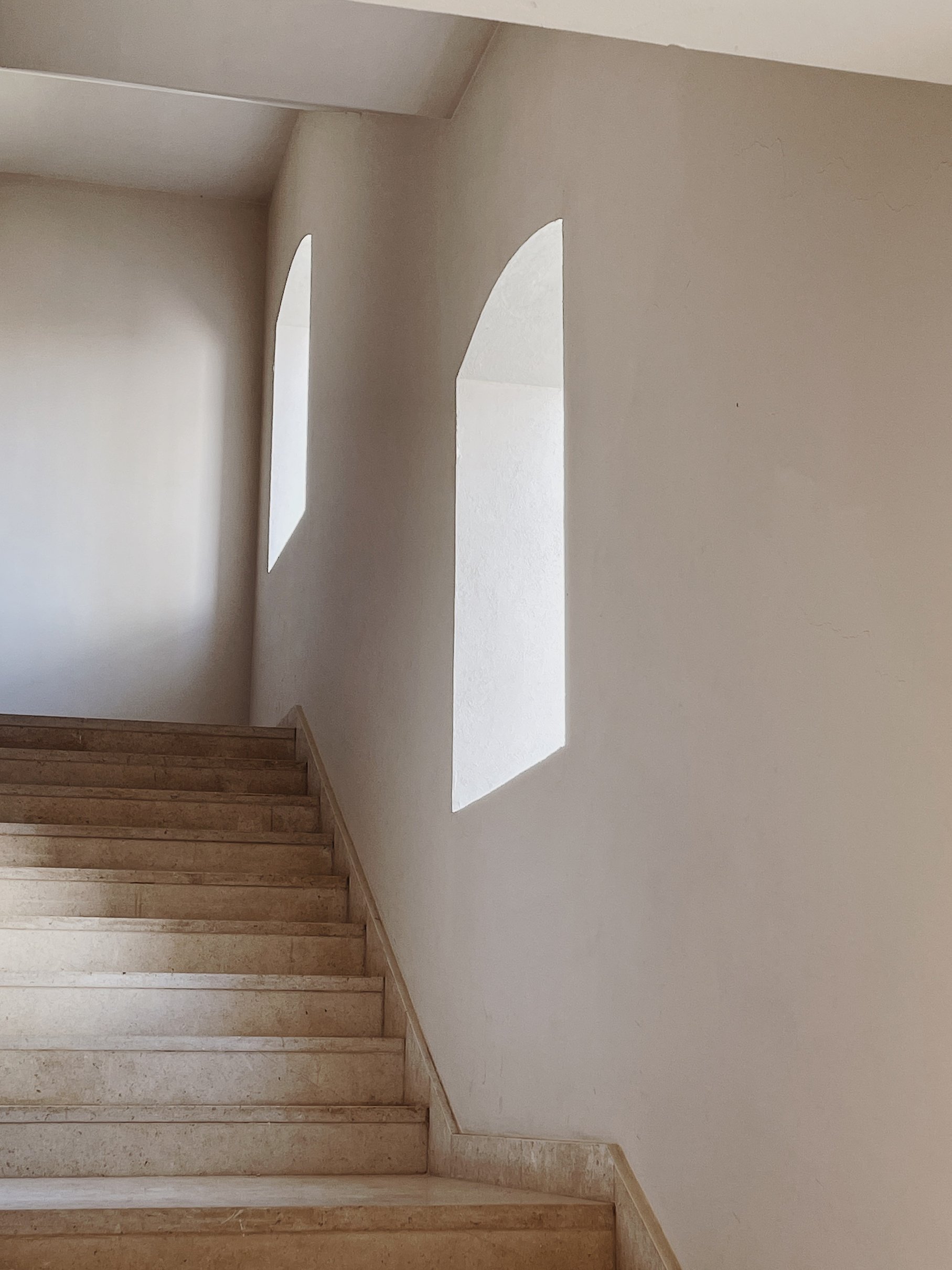  Windows on the Wall near the Stairs of Modern Building